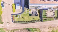 Raum für Ruhe und Stil - Moderne 3-Zimmer-Wohnung mit privatem Garten - Drohnenaufnahme