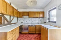 Außergewöhnliche Architektur trifft Raumwunder - Haus mit Wintergarten & großem Außenbereich - Küche