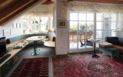 Exklusive Villa im Stil eines Südtiroler Chalets in traumhafter Randlage von Haßloch - Wohnzimmer