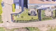 Raum für Ruhe und Stil - Moderne 3-Zimmer-Wohnung mit privatem Garten - Drohnenaufnahme