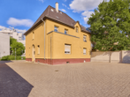 Wertbeständige Kapitalanlage: 9-Parteienhaus mit Altbaucharakter - Rückansicht