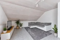 Wohnen mit Mehrwert: Einfamilienhaus mit Einliegerwohnung - Wohnzimmer_ELW