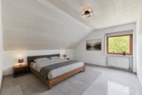 Wohnen mit Mehrwert: Einfamilienhaus mit Einliegerwohnung - Schlafzimmer_ELW