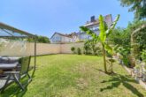 Teilsaniertes Einfamilienhaus mit Gartenidylle in zentraler Lage - Garten