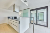Inszenierte Lichtachsen & klare Linien:Architektenvilla mit beeindruckender Raumhöhe in Feldrandlage - Küche