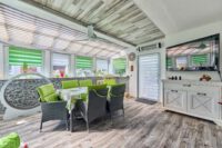 Wohnen mit Extra-Vorteil: Familienwohnhaus mit vermieteter Souterrainwohnung und sicheren Einnahmen - Wintergarten