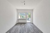 Kernsanierte 3-Zimmer-Wohnung mit hellen Räumen, Balkon & Gartenterrasse - Schlafzimmer