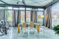 Wohnensemble mit Dreiseithof-Charakter, Wintergarten & mediterranem Flair - Wintergarten