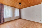 Vielseitiges Einfamilienhaus mit flexiblen Aufteilungsmöglichkeiten & besonderer Dachterrasse - Wohnzimmer